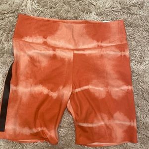 Large Nike One Luxe Shorts. Orange
